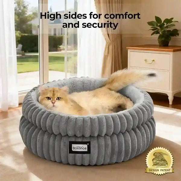 Cozy gray cat bed with high sides for comfort, featuring a fluffy orange cat relaxing inside.2
