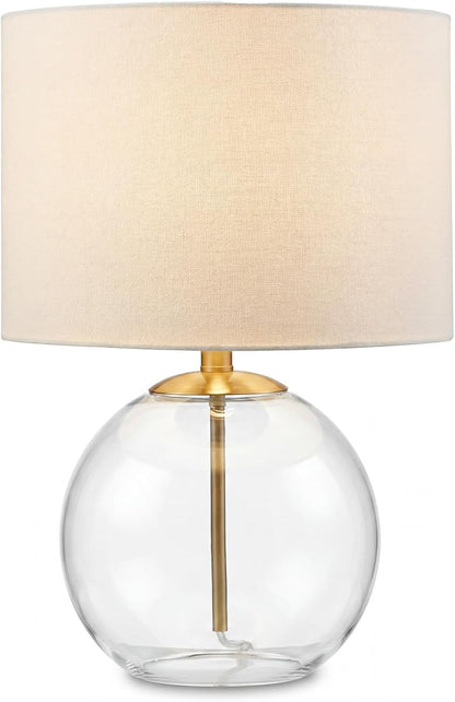 Signature Design by Ashley Glass Table Lamp, Modern Bedside, Clear & Brass | White Fabric Drum Shade, Compact round Clear Glass Profile for Modern Nightstands, Samder Series1