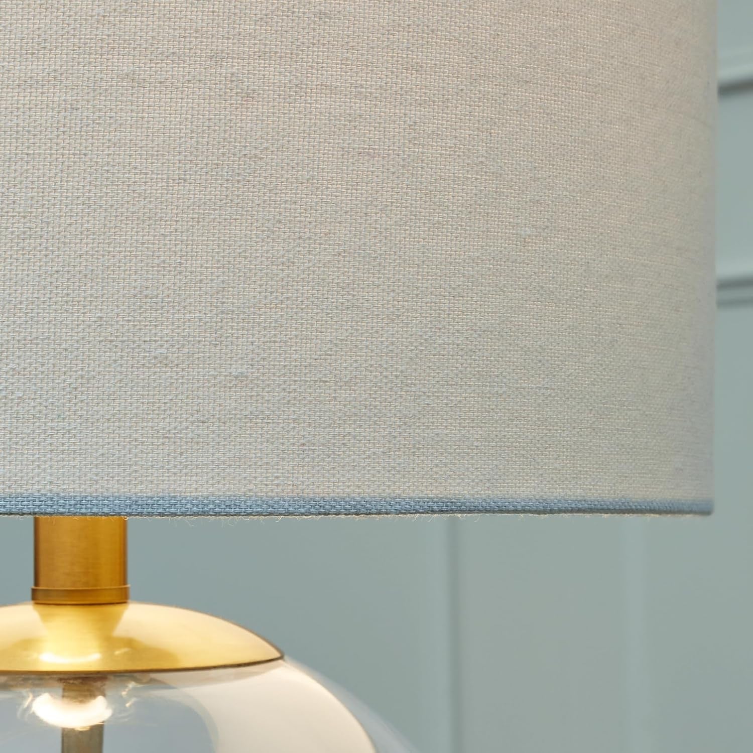 signature-design-by-ashley-glass-table-lamp-modern-bedside-clear-brass-white-fabric-drum-shade-compact-round-clear-glass-profile-for-modern-nightstands-samder-series