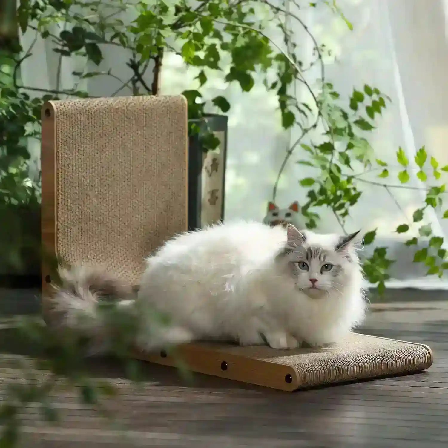 fluffy-white-cat-lounging-on-a-wooden-scratcher-with-sisal-surface-surrounded-by-greenery
